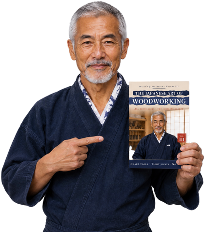 Masao Hayashi holding The Japanese Art of Woodworking